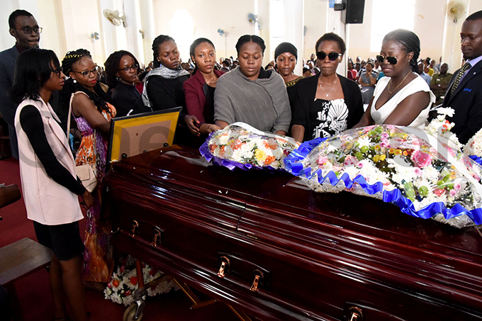 he deceaseds friends lay a wreath hoto by palanyi sentongo