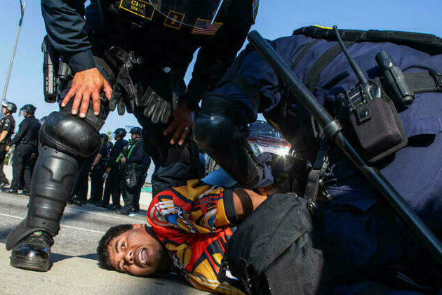 'Mass arrests' underway as LA police enforce overnight curfew