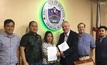 Governor David Suarez (second  from  left) with Brian Allen and Graham Elliott signing the Land Agreement in Lucena.