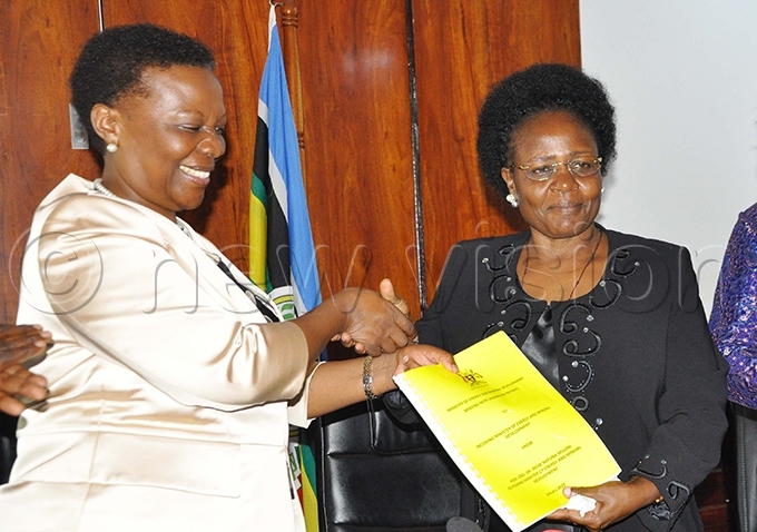 rene uloni  handing over ministerial documents to ary oretti itutu hoto by ancy anyonga