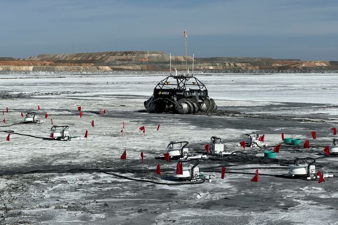 An Arca rover and measurement equipment on a tailings dam.