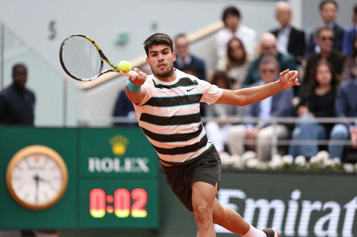 Alcaraz rallies to beat Sinner in five sets to retain French Open title