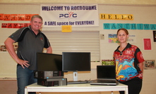 CPM's Damien Piro handing the computers over to a Roebourne local