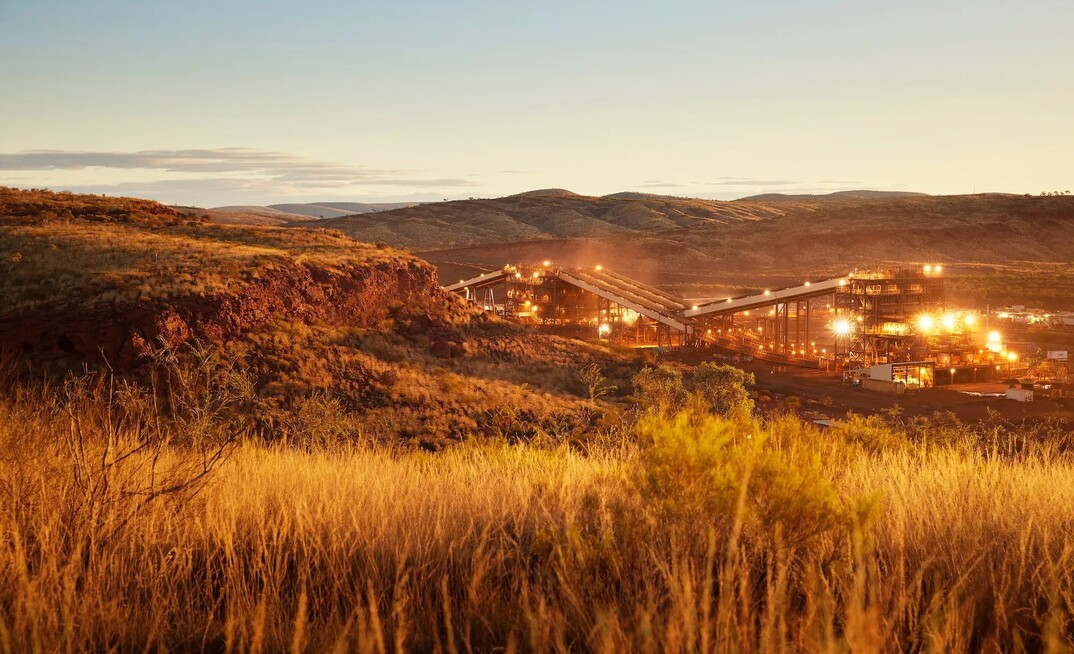 Fortescue cuts dividend as profit slides