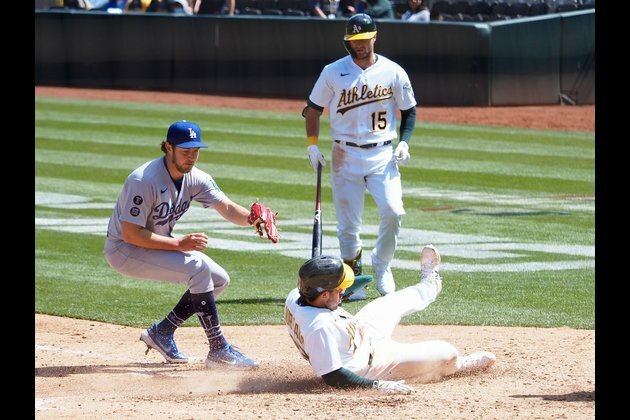 Athletics beat Dodgers in 10 to grab first win of season