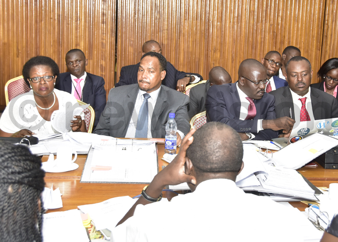 uhanga listens to a question from  andala afabi during the hearing at arliament hotos by aria amala