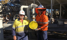 NCZ's Jeff Langton and Ausenco's Christian Small with a cleaning pig used to successfully commission the concentrate slurry pipeline.