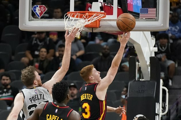 Trae Young's double-double leads surging Hawks past Spurs