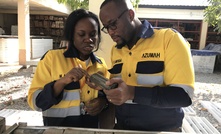  Geologists inspecting core at Wa