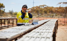  A Mincor geologist inspecting core