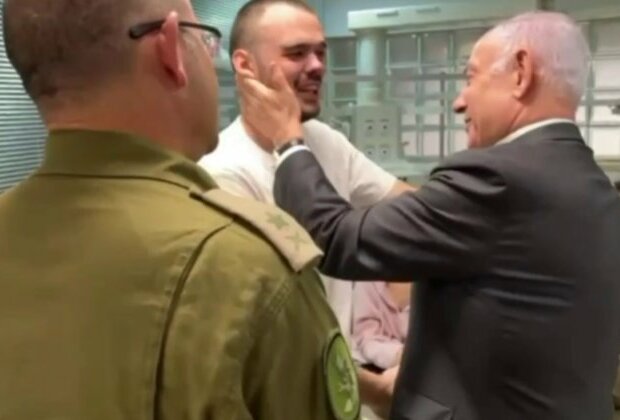 Rescued Russian hostage hugs Netanyahu