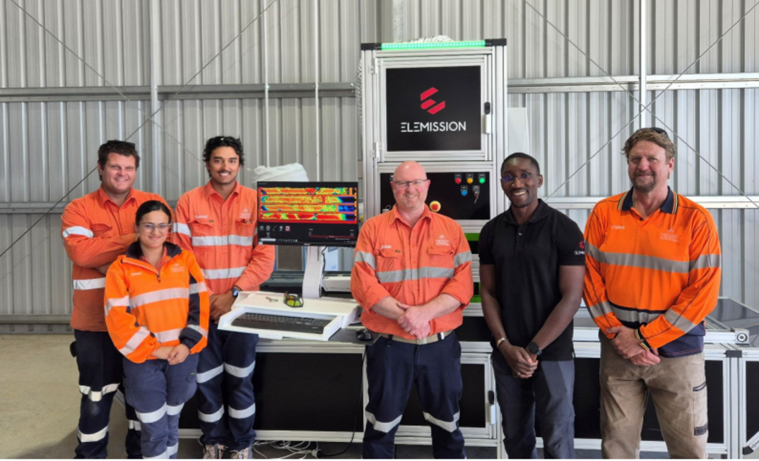 Hillgrove geological team with Ecore Elemission technician in front of the Ecore core scanning system at Larvotto’s exploration facility.