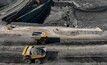  Haul trucks used as part of interburden removal to expose the next coal seam at the Carmichael mine.