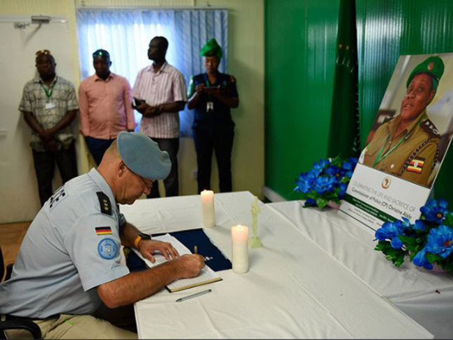   staff signs condolence book in honour of hristine lalo  hoto