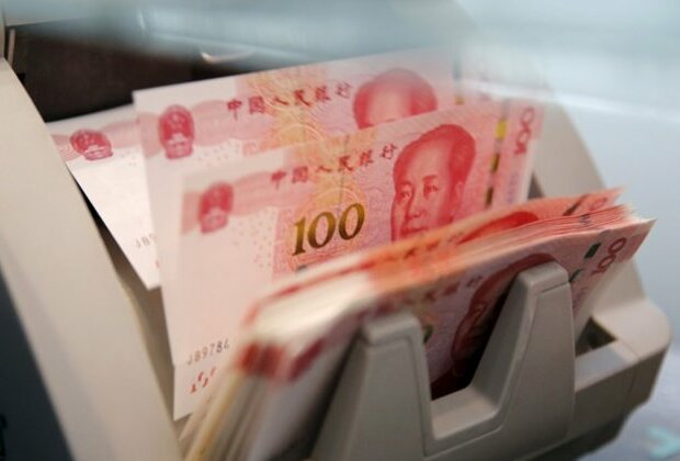 China's yuan sinks to record low against dollar ahead of key National Congress