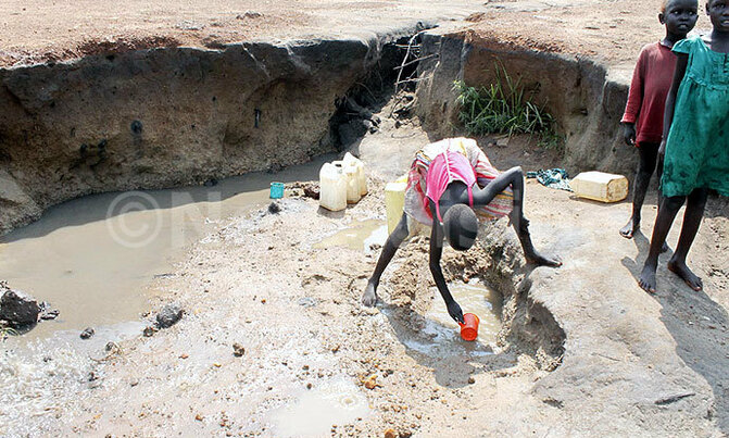 A refugee's daily struggle for a scoop of water A refugee's daily struggle for a scoop of water