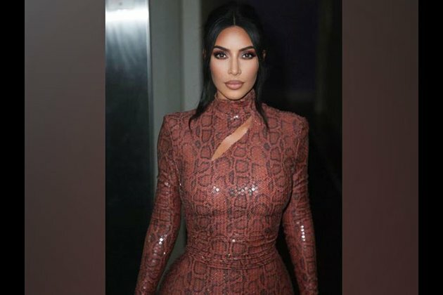 Kim Kardashian jokes about struggle of taking a photo with all 4 kids