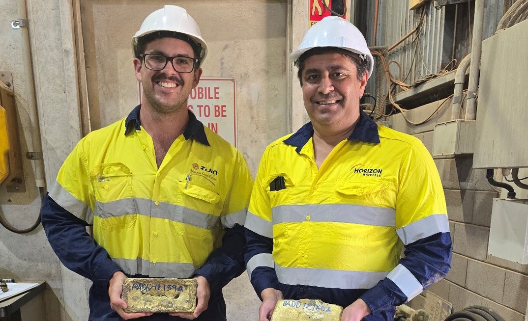 Norton senior project geologist Jacob Lynch-Harlow and Horizon CFO Julian Tambyrajah with the first gold bars poured from Boorara.