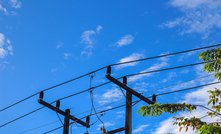 Electric poles and blue skies.