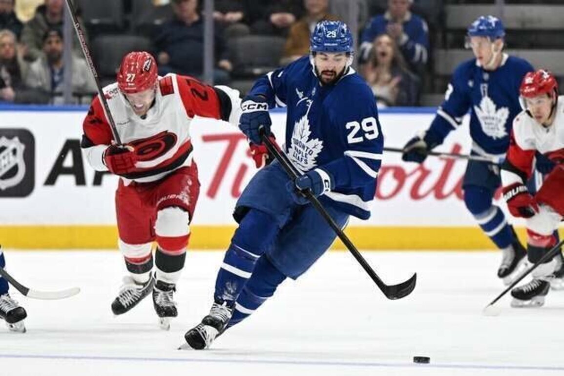Hurricanes top Maple Leafs in OT, close in on 100 points