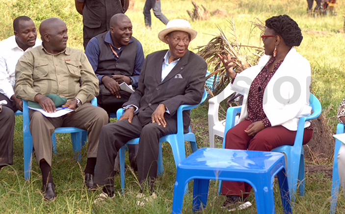 and probe commission chairperson atherine amugemereire right interacts with commissioners obert sebunya 2nd right and eorge agonza left during the field visit by the commission hoto by enis ibele