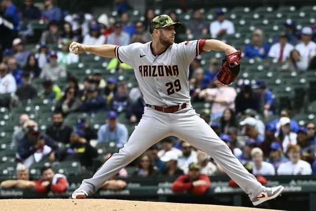 Blasts by Patrick Wisdom, Frank Schwindel lift Cubs over Diamondbacks