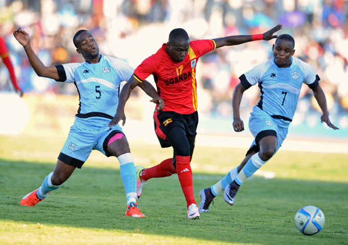 idfielder arouk iya evades otswanas midfielder ebogo osome  during the match  hoto