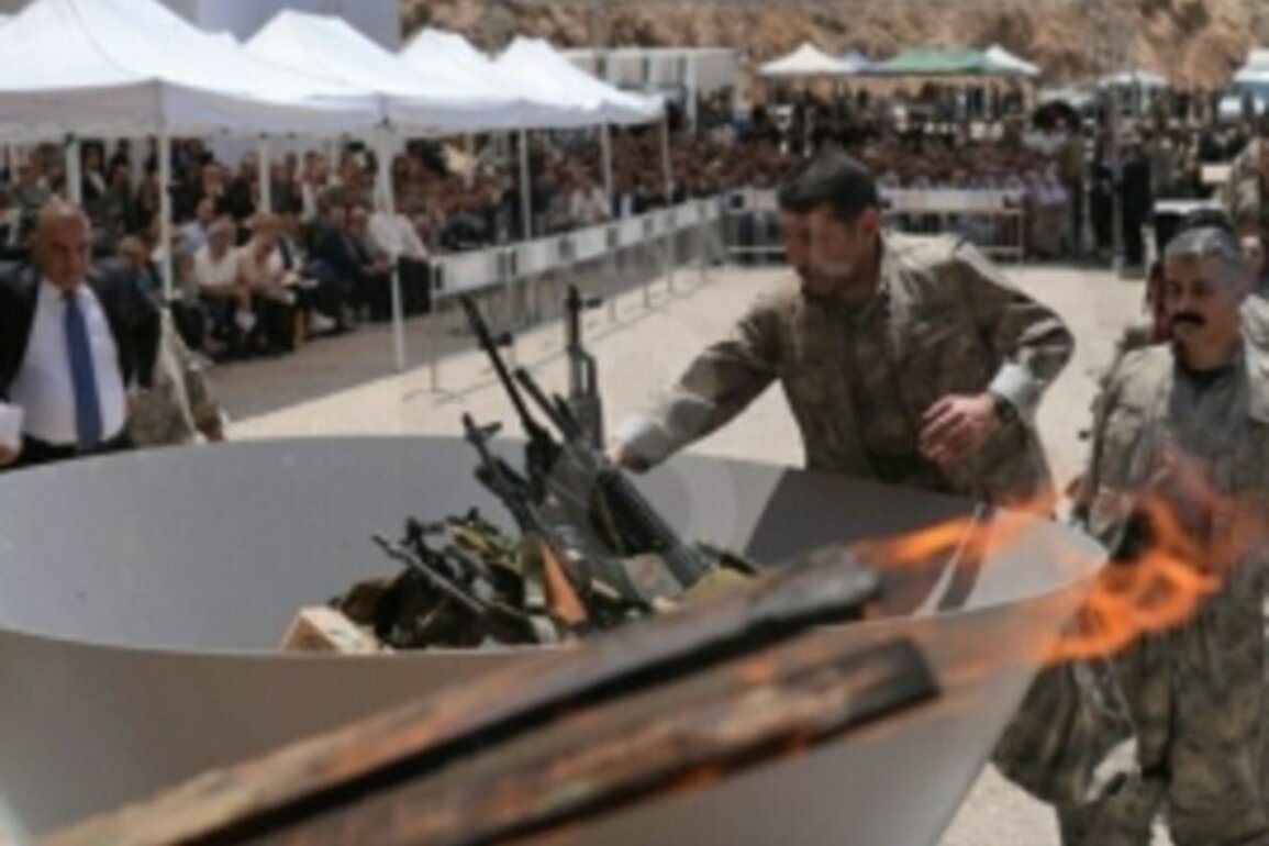 PKK militants burn weapons in symbolic Iraq ceremony