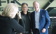 Nvidia’s Jensen Huang and Volvo Group’s Martin Lundstedt standing in front of a prototype of Volvo’s autonomous, battery-electric HX2 load carrier