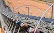 Platinum rock being moved on a conveyor belt.