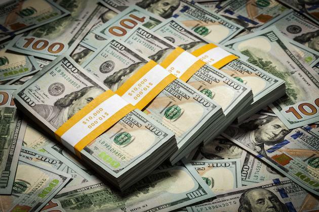 U.S. dollar stays nearly flat despite high jobless claims