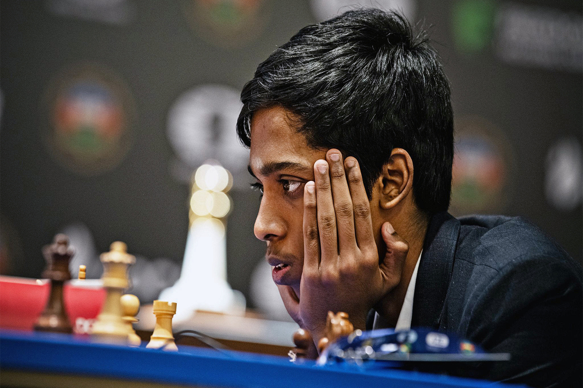 R Praggnanandhaa plays a game of chess with Adani Group chairperson Gautam Adani