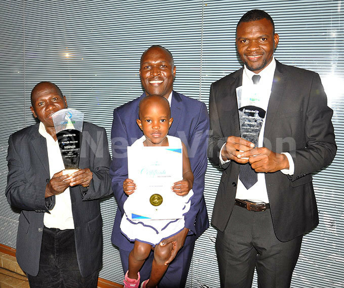   rom left to right rancis  morut who was the winner of print news features ater media award eputy nline ditor elson aturinda with ine obugabe aturinda who represented icky andawa and wen agabaza winner of online ater edia award posing for the picture after victory his was at mperial oyale ampala on ctober 26 2018 hoto by amadhan bbey