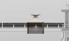 Part of the system uses a drone to monitor open conveyor belts.