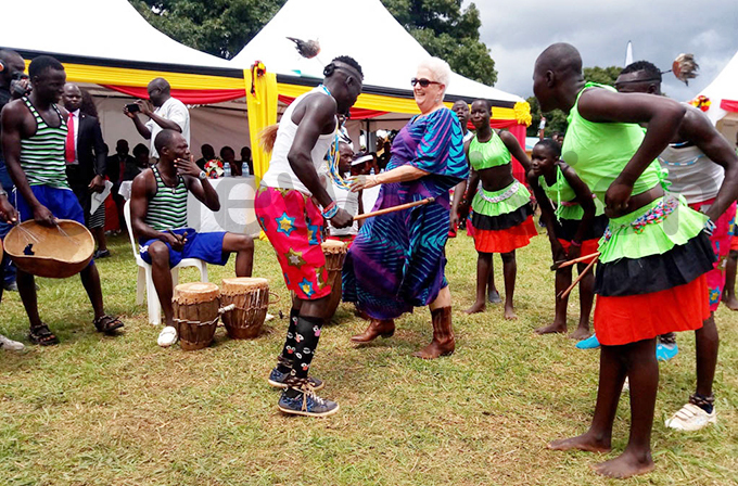  mbassador to ganda eborah alac the takes part in a local dance during the launch in woya district hoto by rnest umwesige