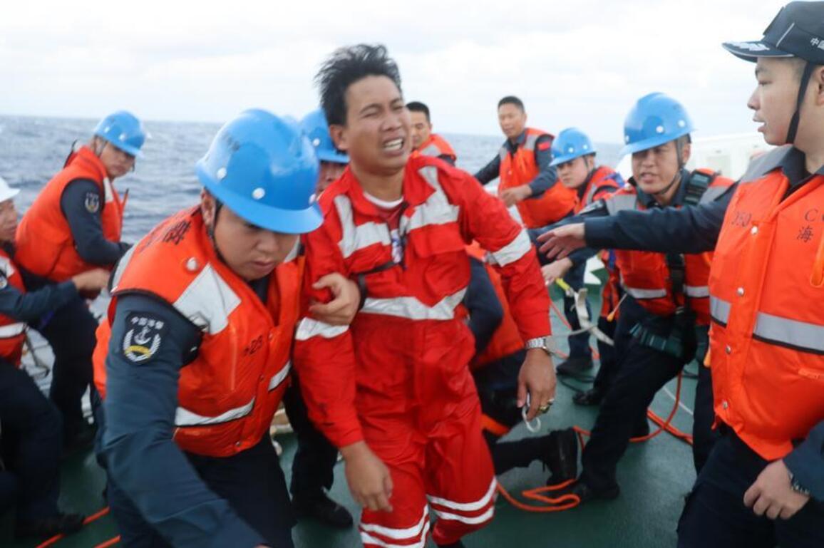 InPics | China Coast Guard rescues Filipino sailors falling overboard in South China Sea