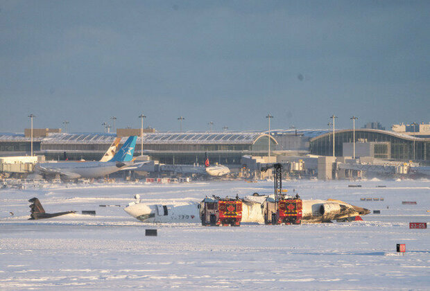 At least 18 injured after plane crashes, flips on landing in Toronto