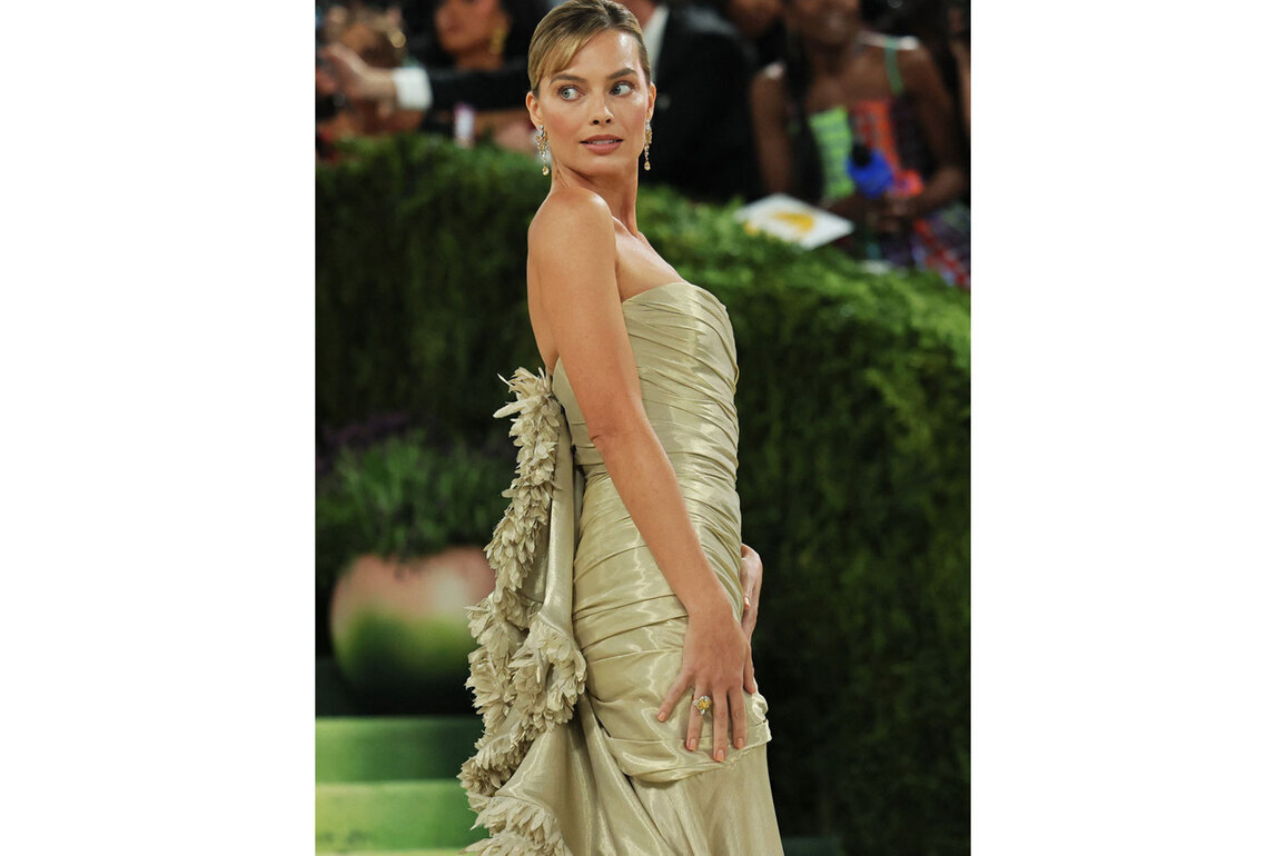 Margot Robbie returns to Met Gala in intricately embroidered gold Chanel gown