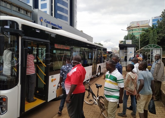 eople gather to look at ayoola bus when it made a stop at the ity square during a oadshow on riday hoto by uth asejje
