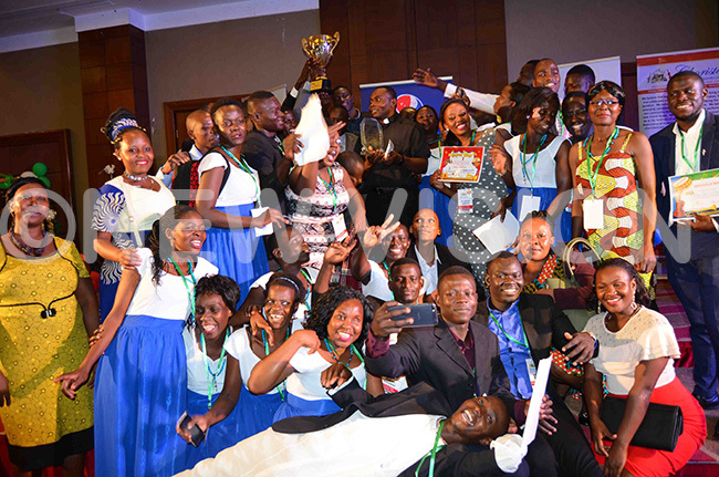  embers of oly rinity amwokya atholic parish choir celebrating after being declared the overall winners of the 5th annual music festival of the horisters ssociation of ganda 