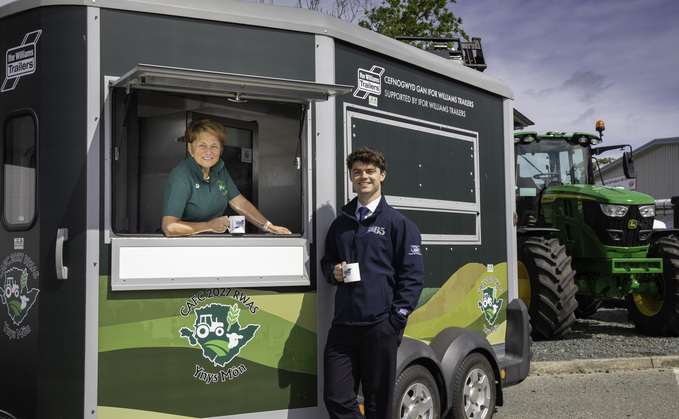 Joe Pardoe of IWT and Susan Jones of Mona Tractors who is president of Anglesey's Royal Welsh feature year volunteer group (Image by Mandy Jones)