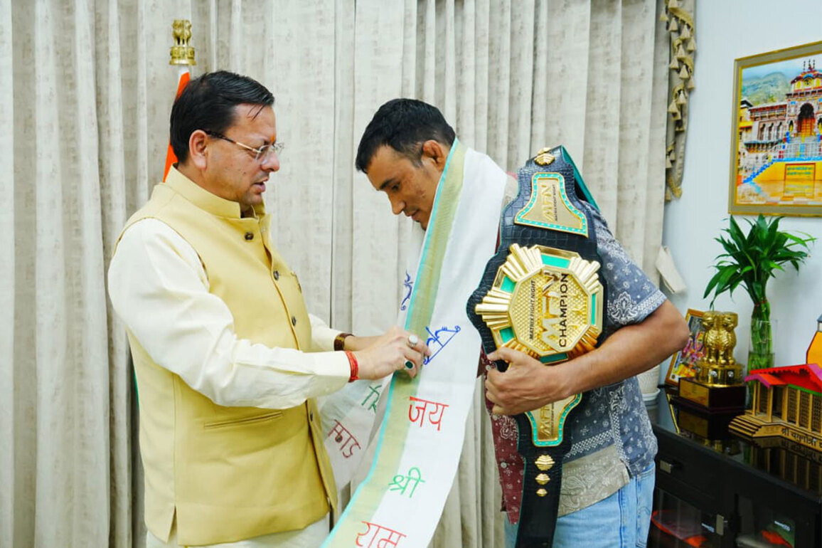Uttarakhand CM Dhami felicitates MFN Lightweight World Champion Digambar Singh Rawat