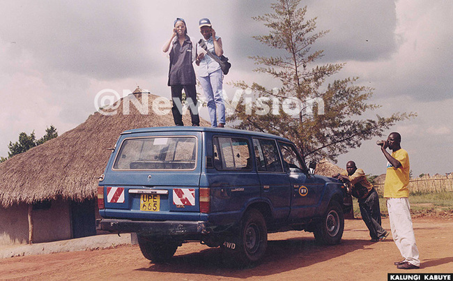  illy uwonge and colleague trying to find network in riwara  after the  launch in rua  uly 2000