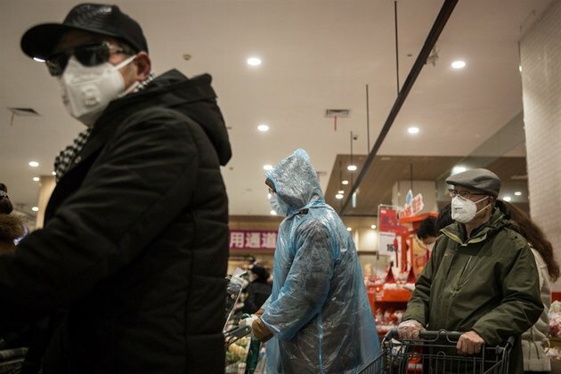 WHO warns of mask shortages as virus cases rise worldwide