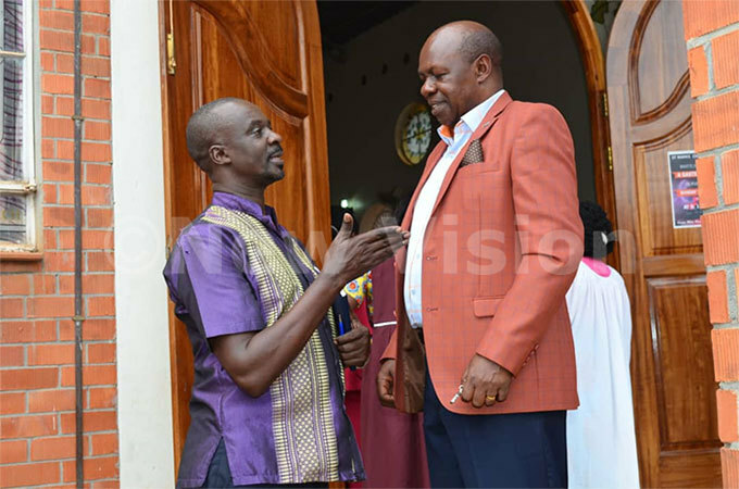  he enior edical officer in charge of onommunicable iseases r erald utungi shares a light moment with state minister for sports harles akkabulindi during the health camp organised on orld ealth ay recently hoto by 