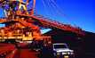 Australia slashes iron ore forecasts