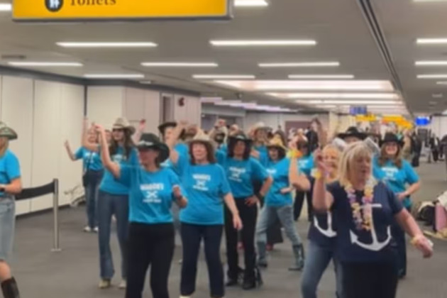 Glasgow Airport flash mob line up to Luke Combs hit before country music cruise