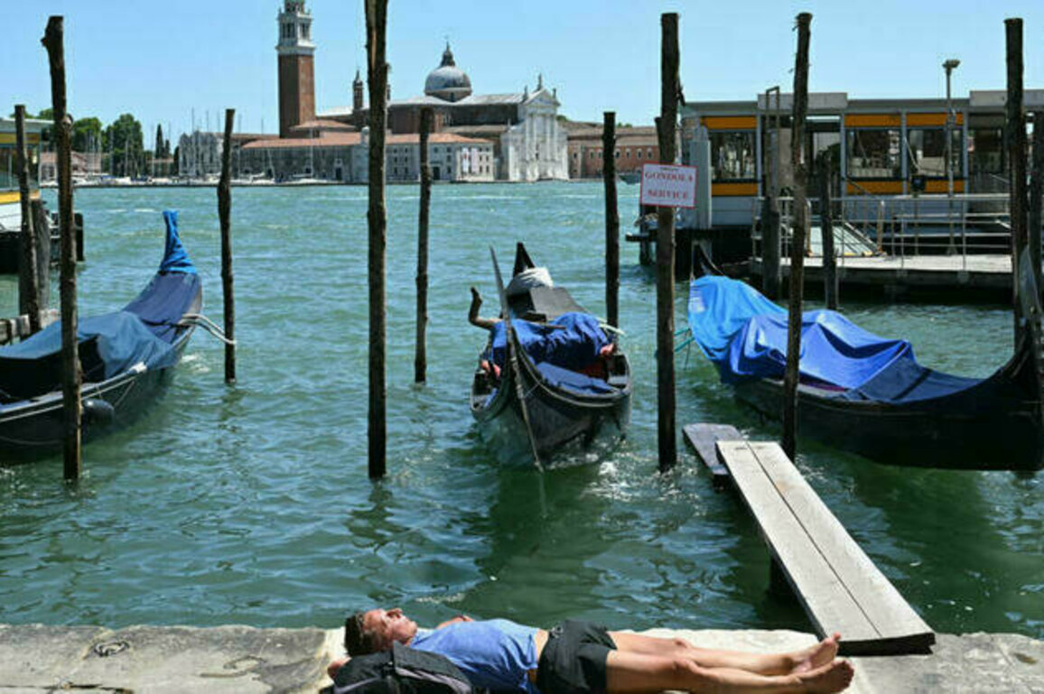 Europe bakes in summer's first heatwave as continent warms