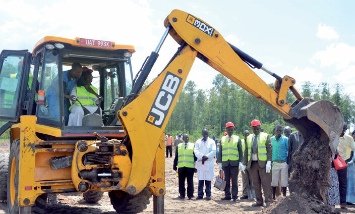  company driver guides amuyangu on how to operate a grader during the breaking of the ground ceremony recently