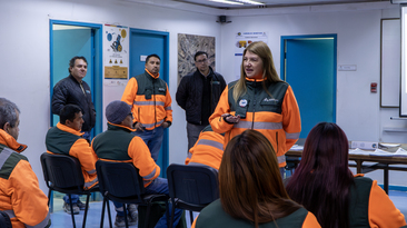 Maria de la Luz Osses speaks with her team